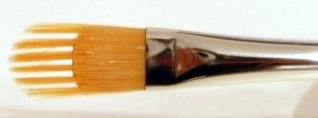 Soft grip rake brush